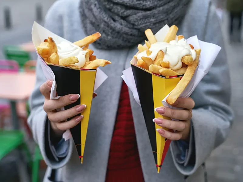 woman-holding-cones-belgian-fries